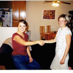 Angela Neve Meier and Julie Guy shaking hands at the beginning of their partnership.